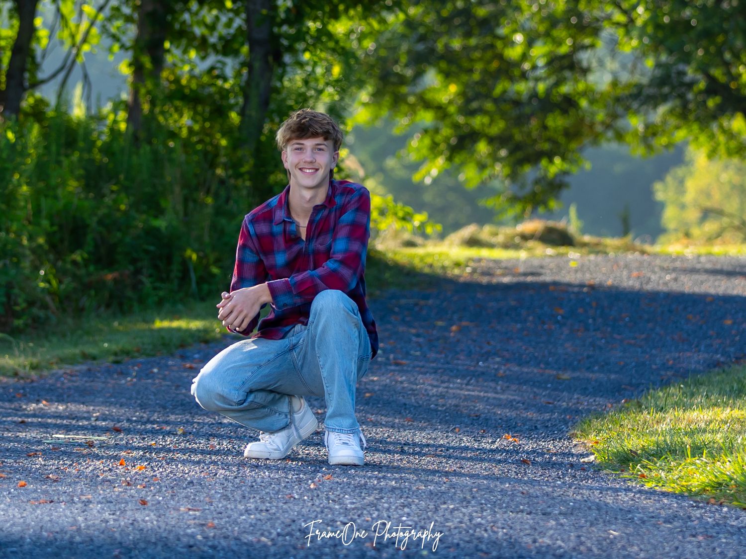 Photographer captures outdoor portrait series at golden hour showing different casual seated poses on gravel path.