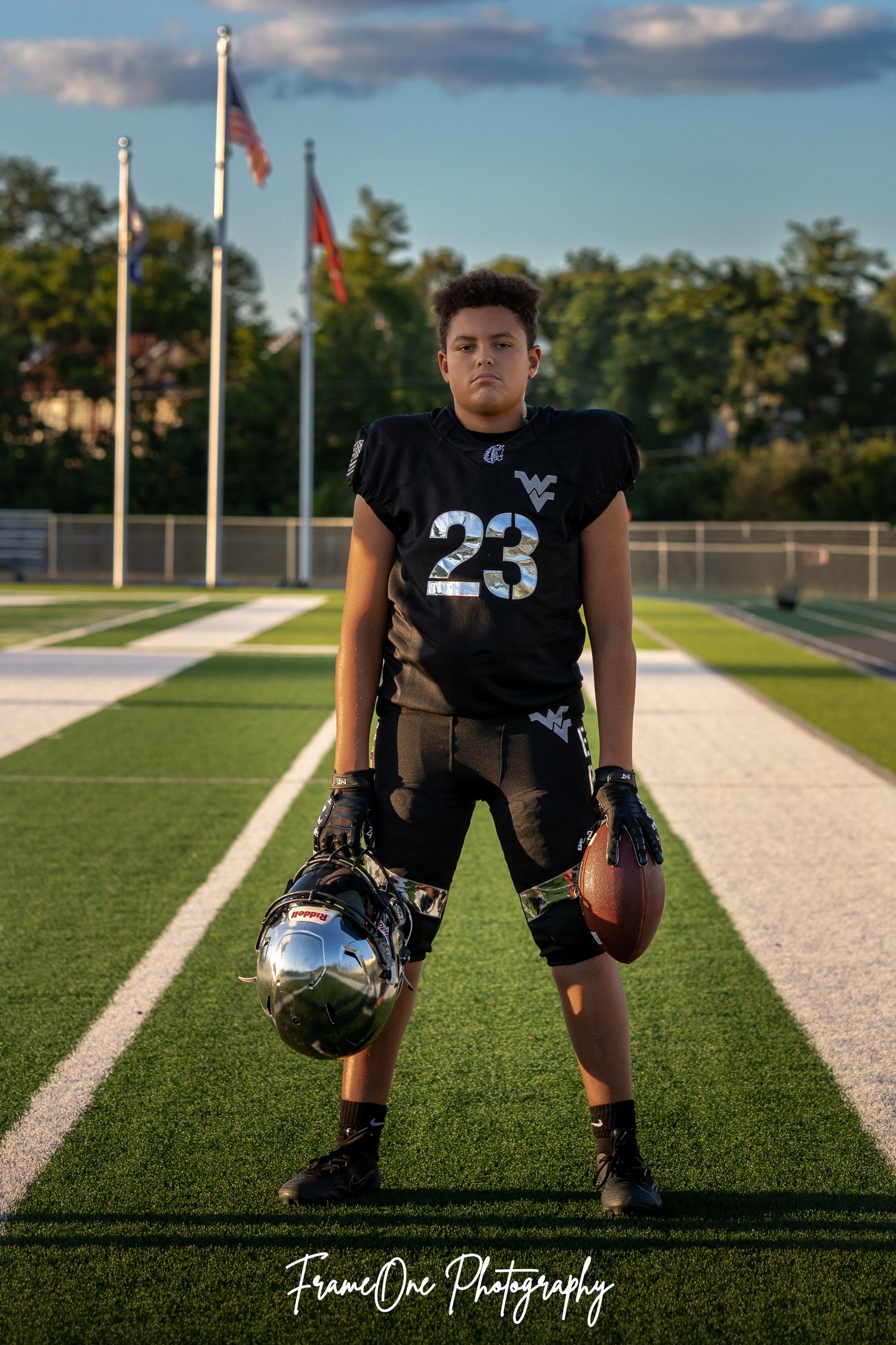 Five sequential photos of a football player wearing jersey number 23 striking different poses on a gridiron field during sunset.