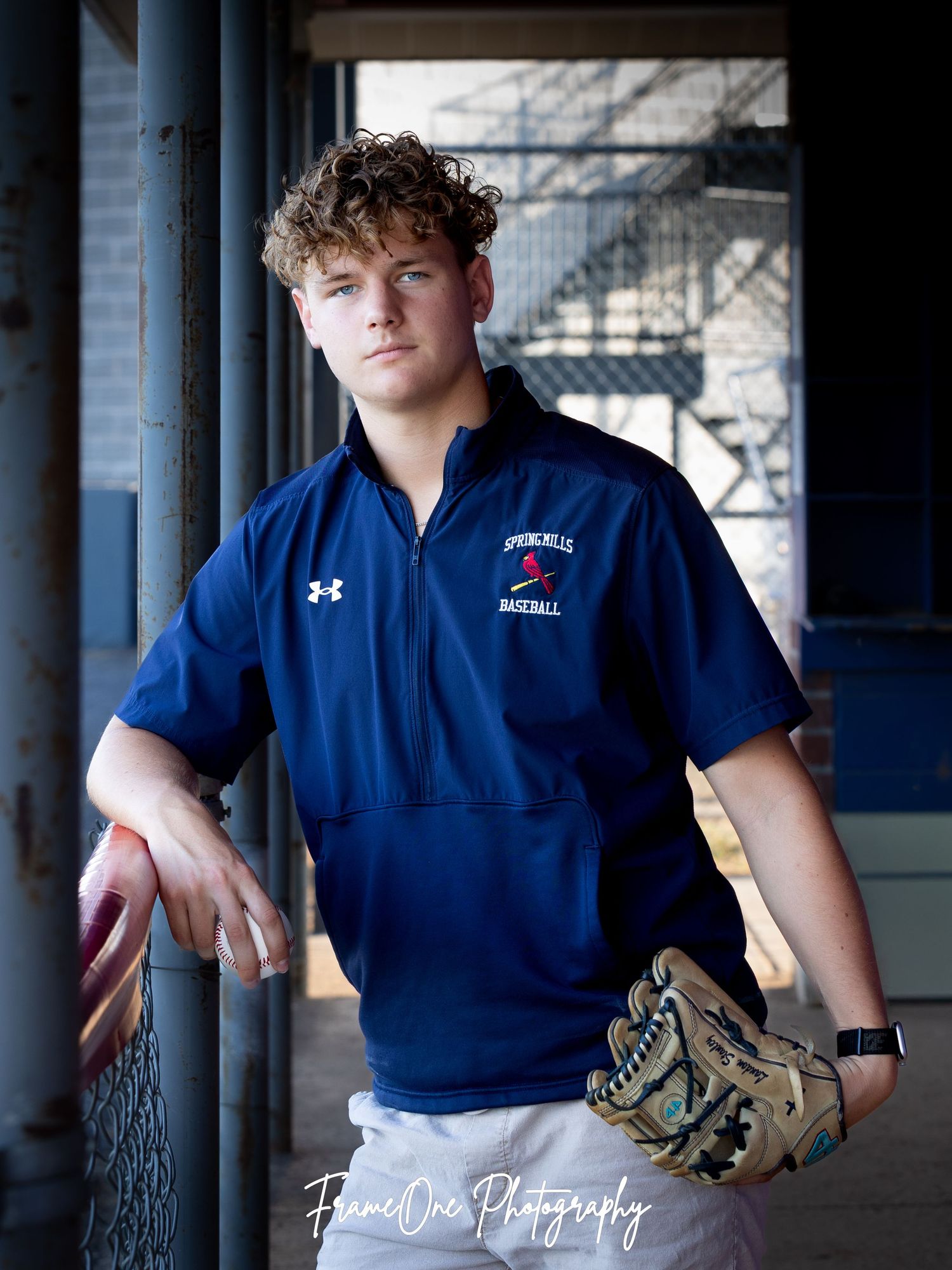 A series of photos showing a baseball player in a blue Under Armour uniform against a columned background.