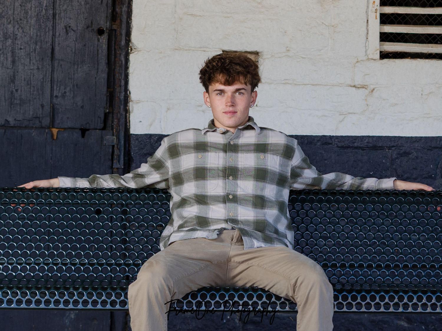 Person in plaid shirt and khaki pants poses in front of stadium seats in multiple action shots.