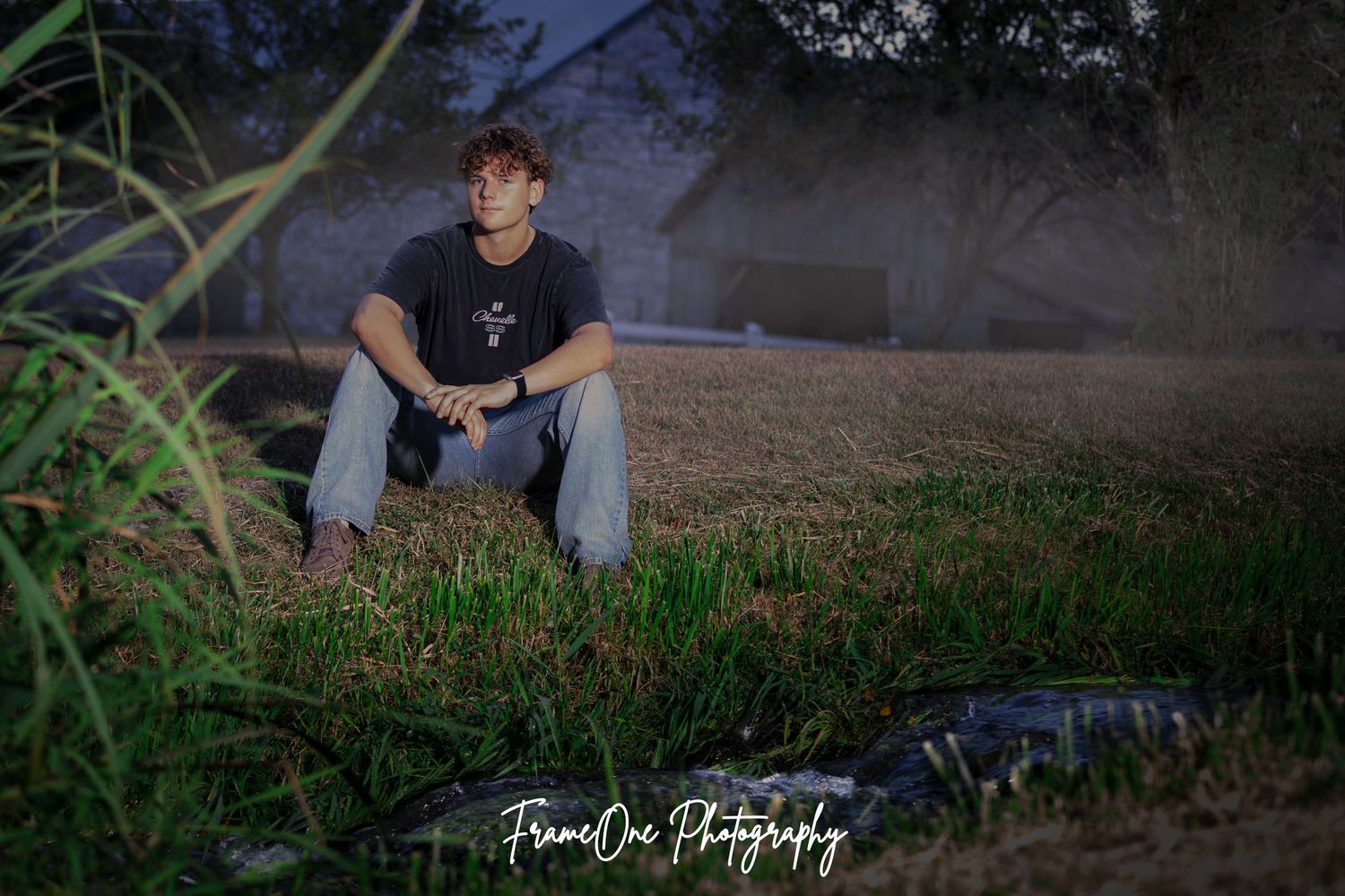 A series of dark moody outdoor portraits taken at dusk showing a person sitting on grassy terrain.