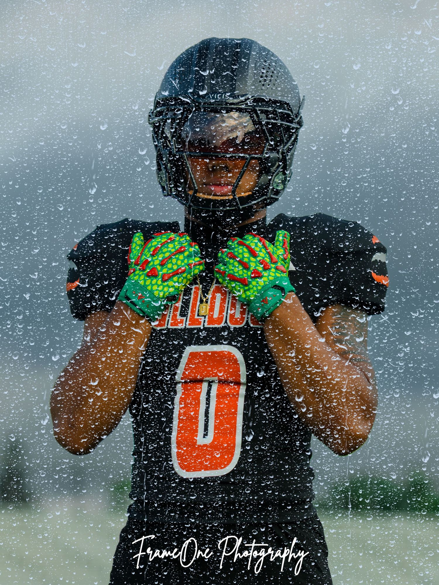 A sequence of artistic sports photographs showing a player in a black jersey with number 0 through falling snow.