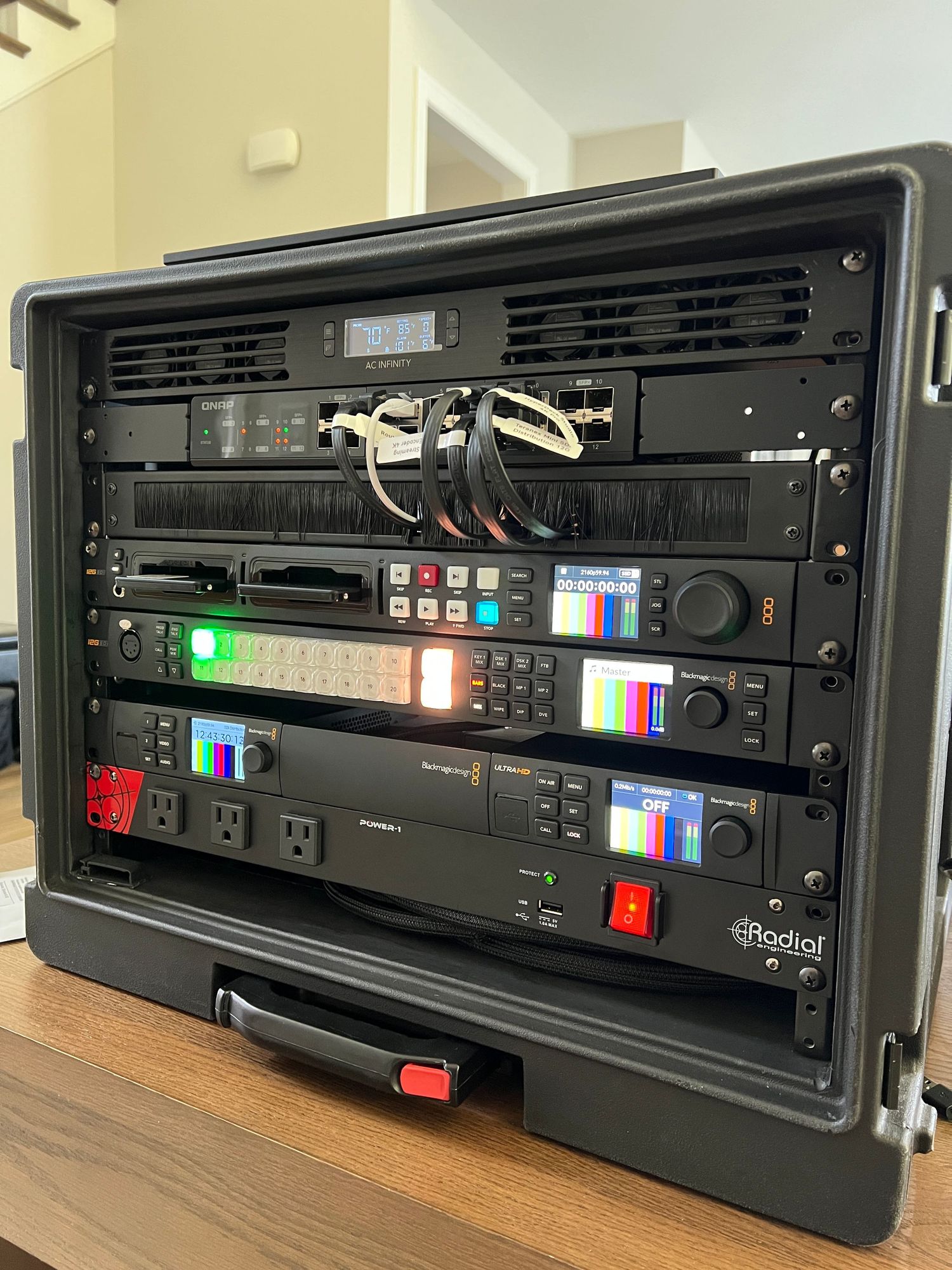 Professional audio rack equipment showing multiple digital display units mounted in black cases.