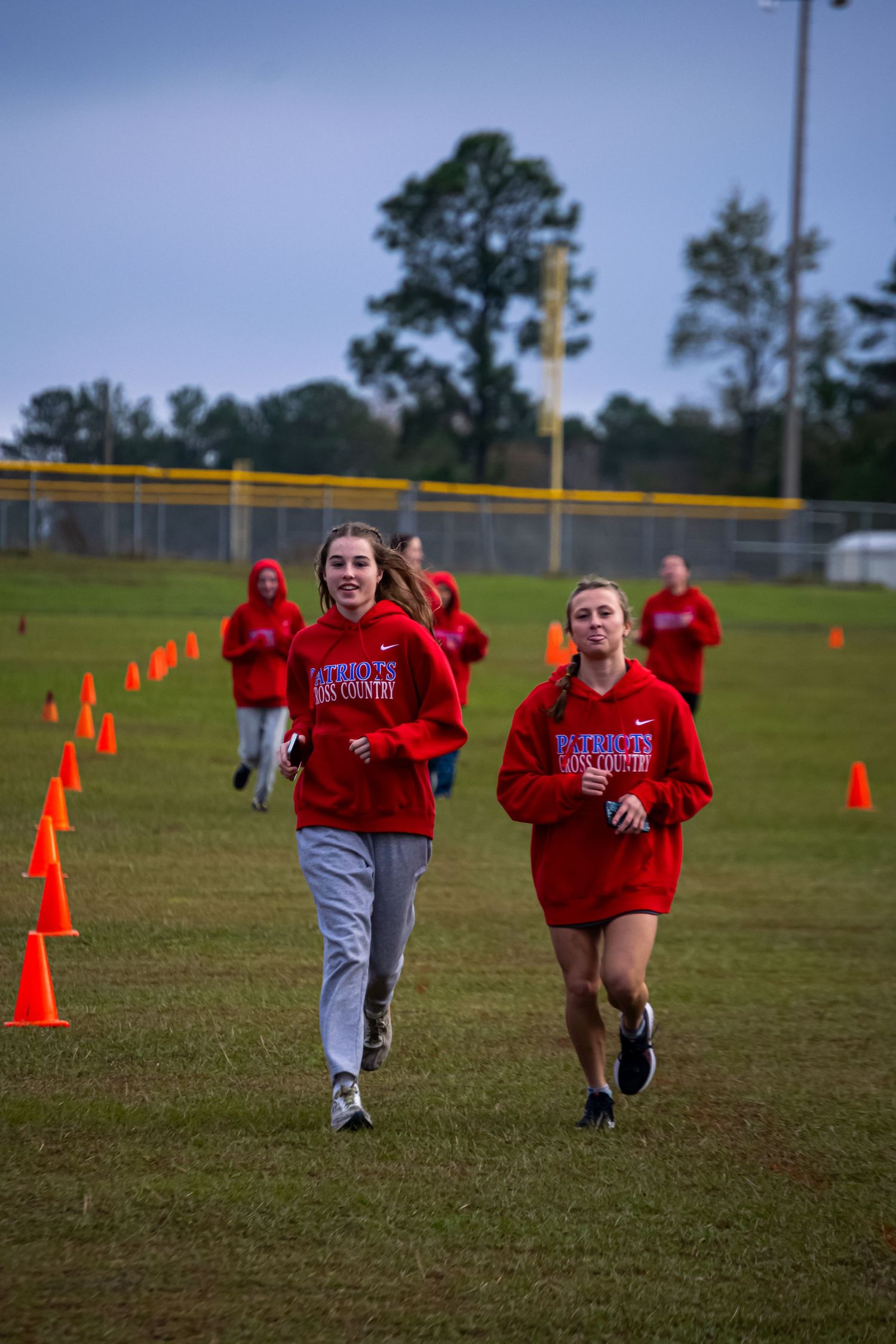 A photo of two women running