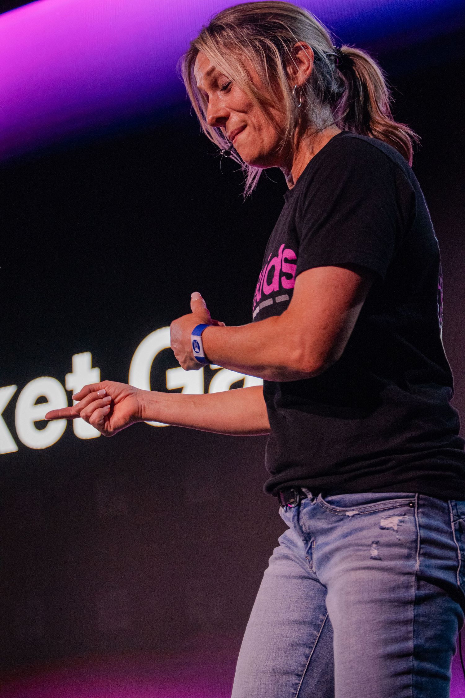 A woman preaching on stage
