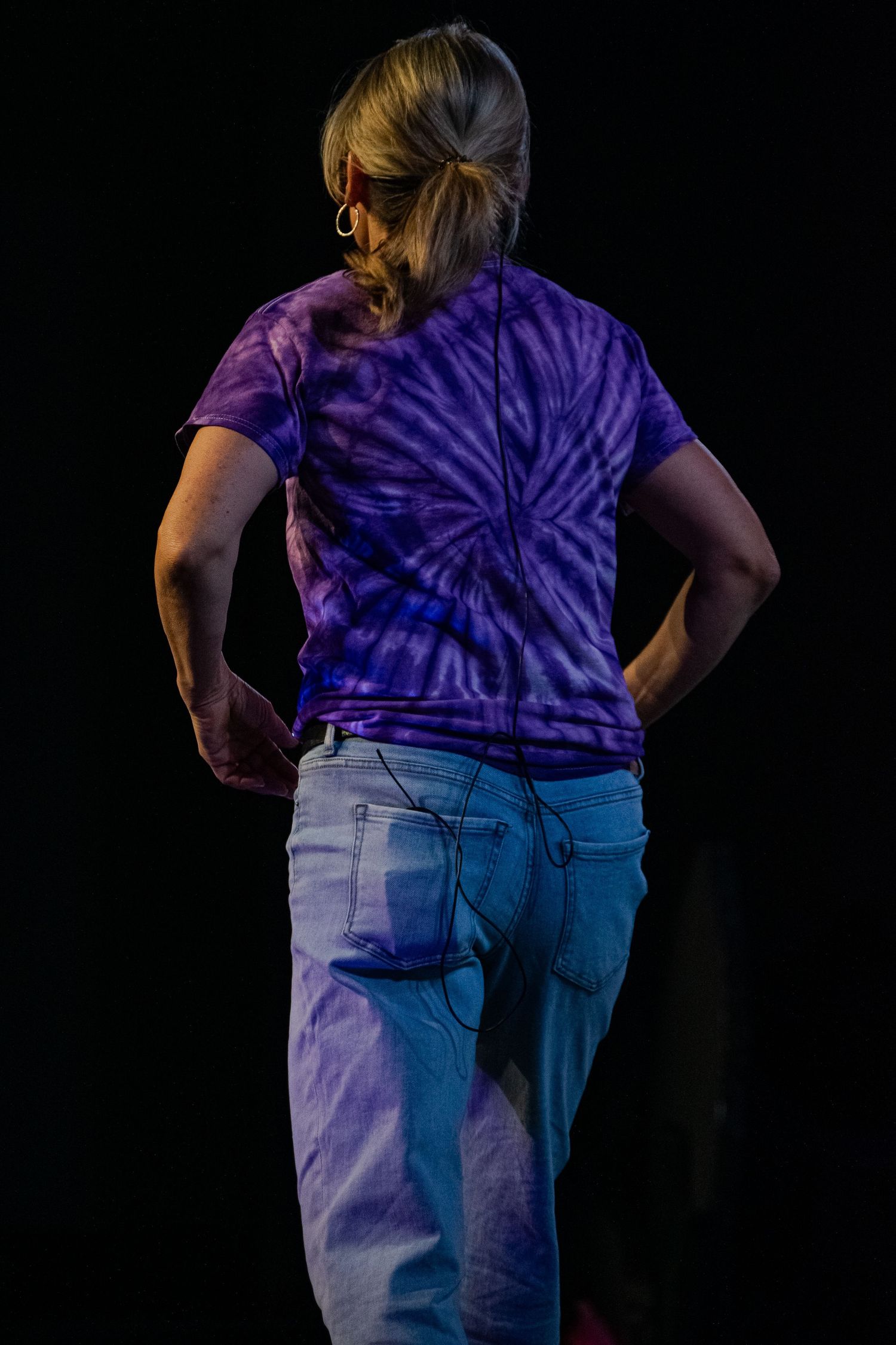 A woman walking across a stage