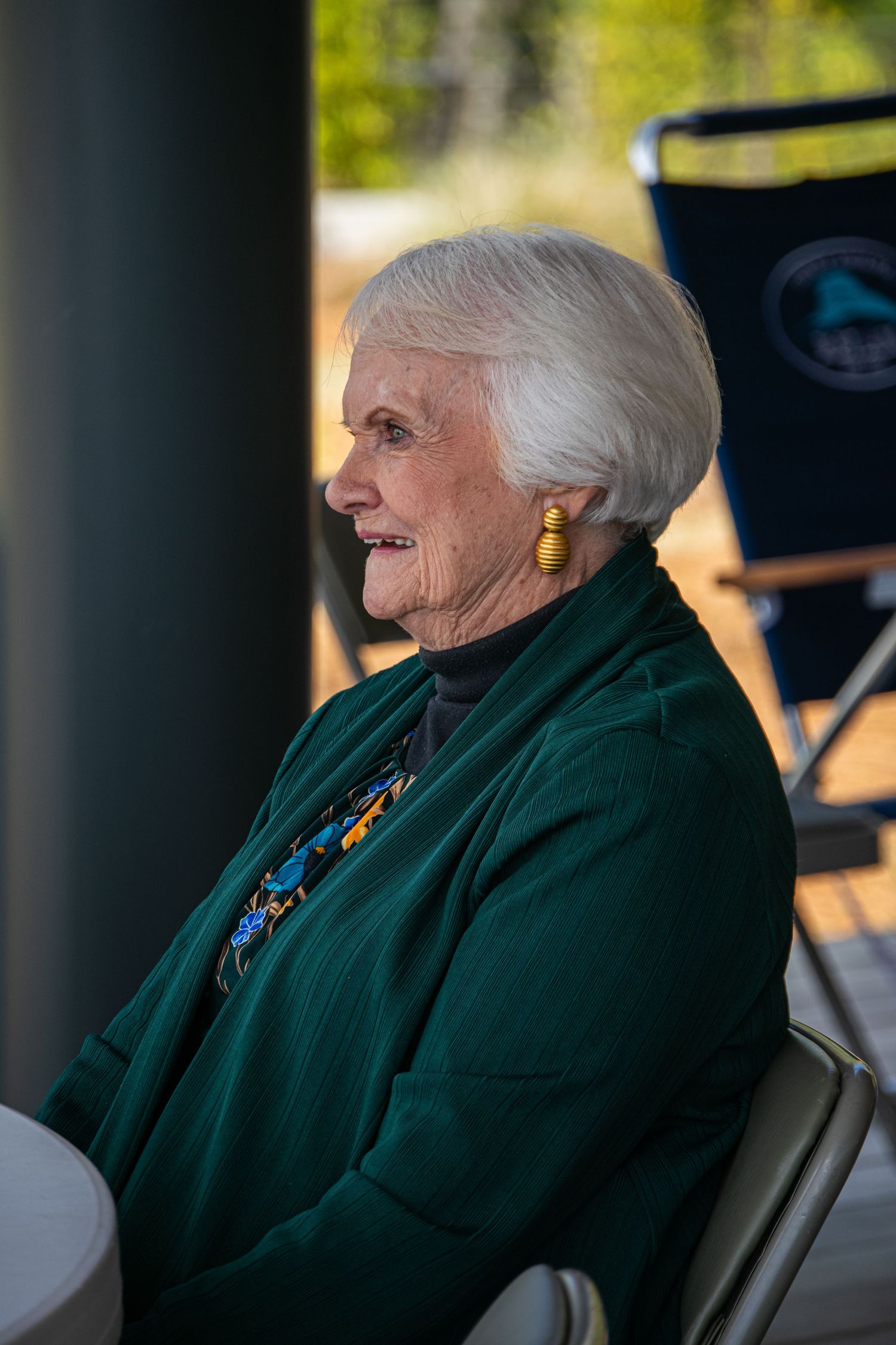 A photo of an elderly lady smiling