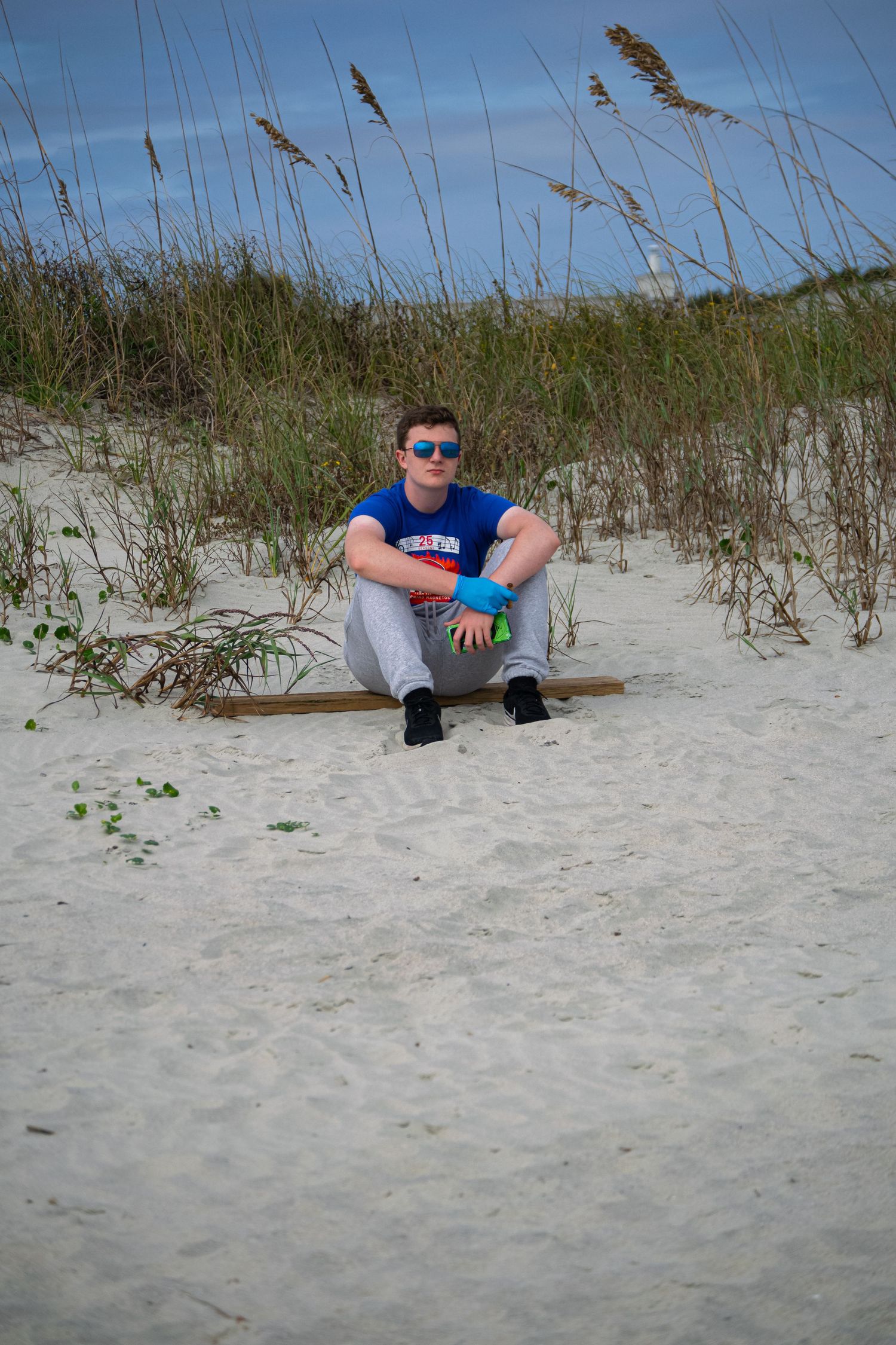 A man sitting at a beach