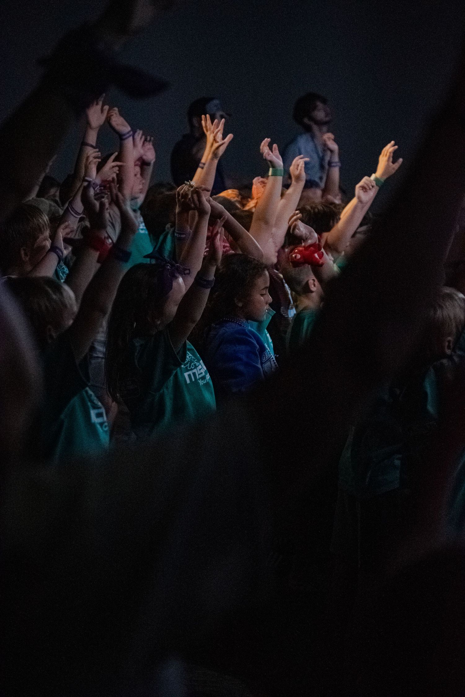 A photo of kids worshiping at a service