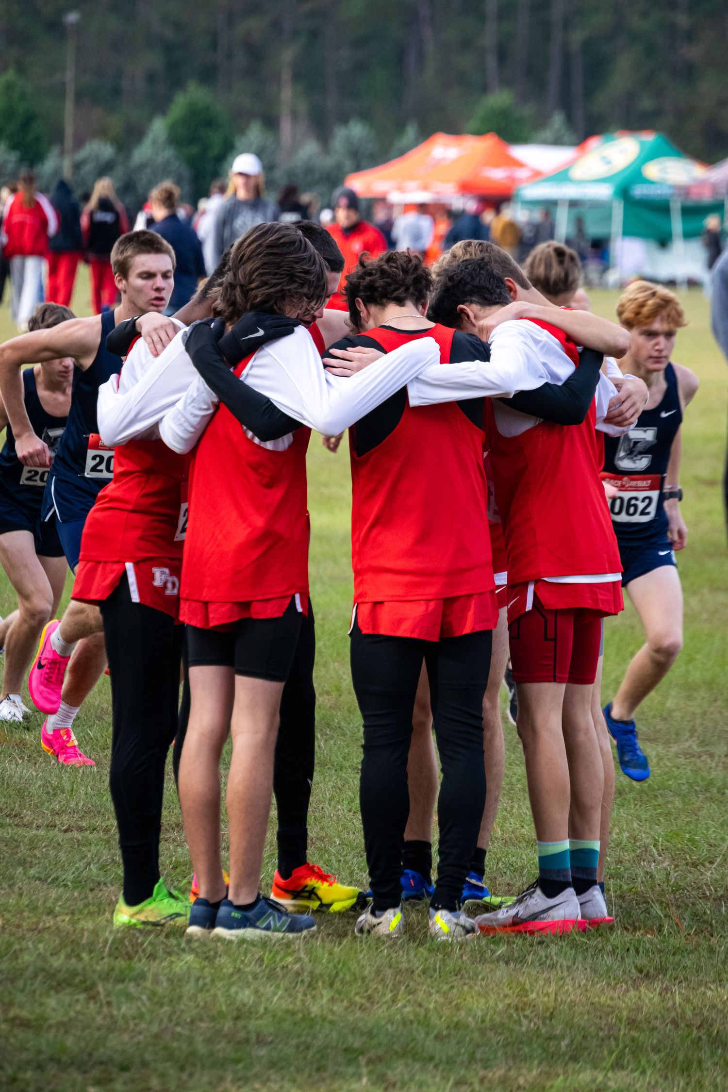A photo of men hugging pre-race