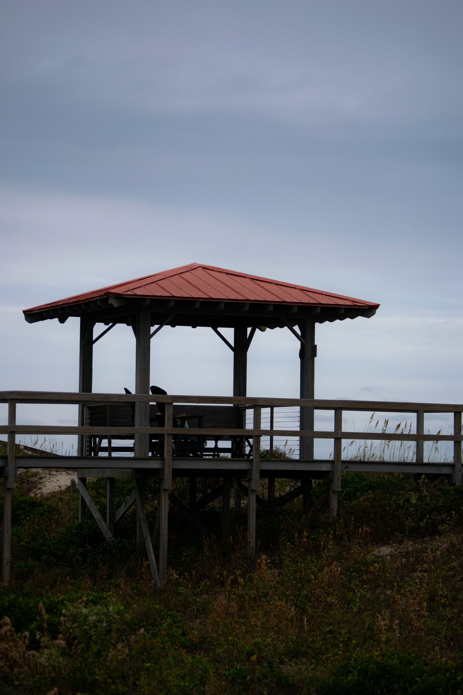 A picture of a pier at a beach