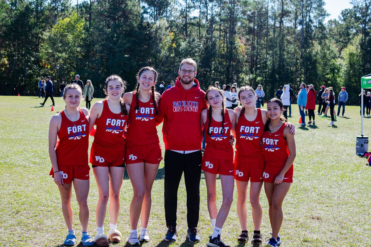 A group photo of a high school girl's cross-country team