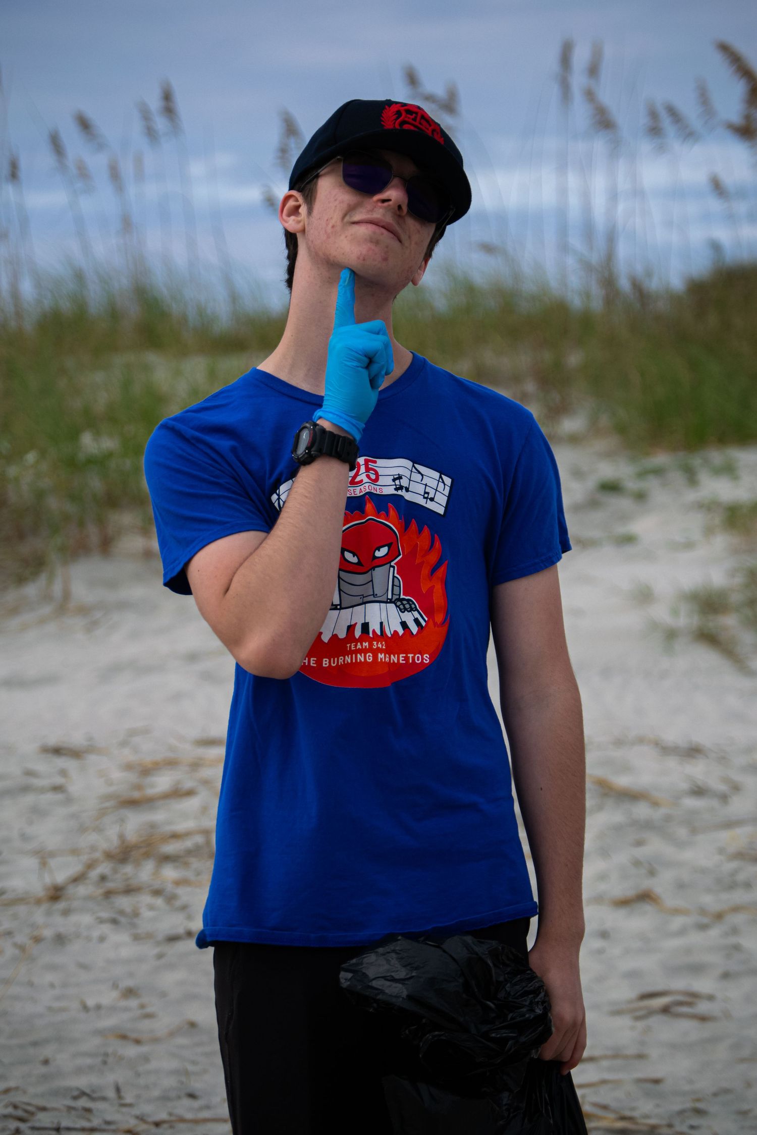 A man posing at a beach