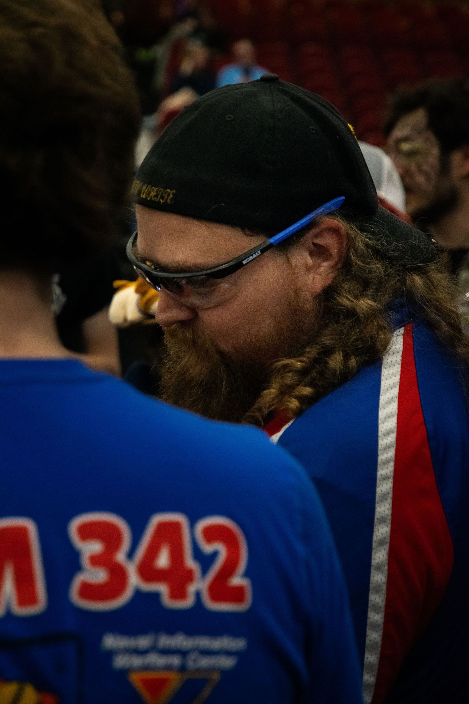A photo of a man looking down.