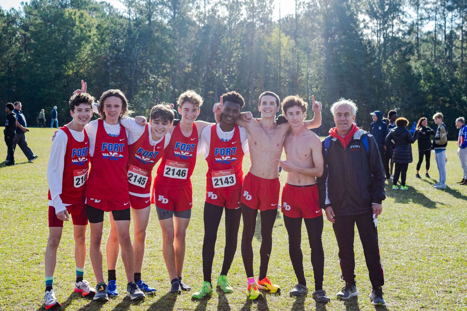 A group photo of a high school men's cross-country team