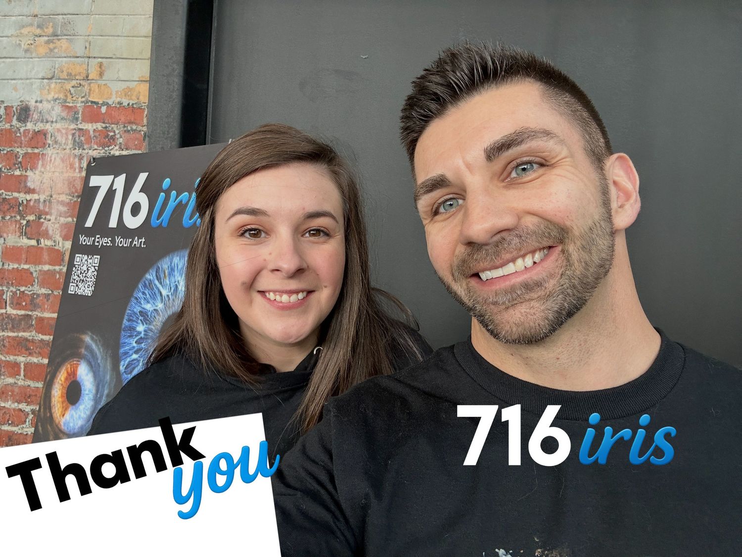 Two smiling people pose together in front of a 716iris banner, with Thank You text overlay in a selfie photo.