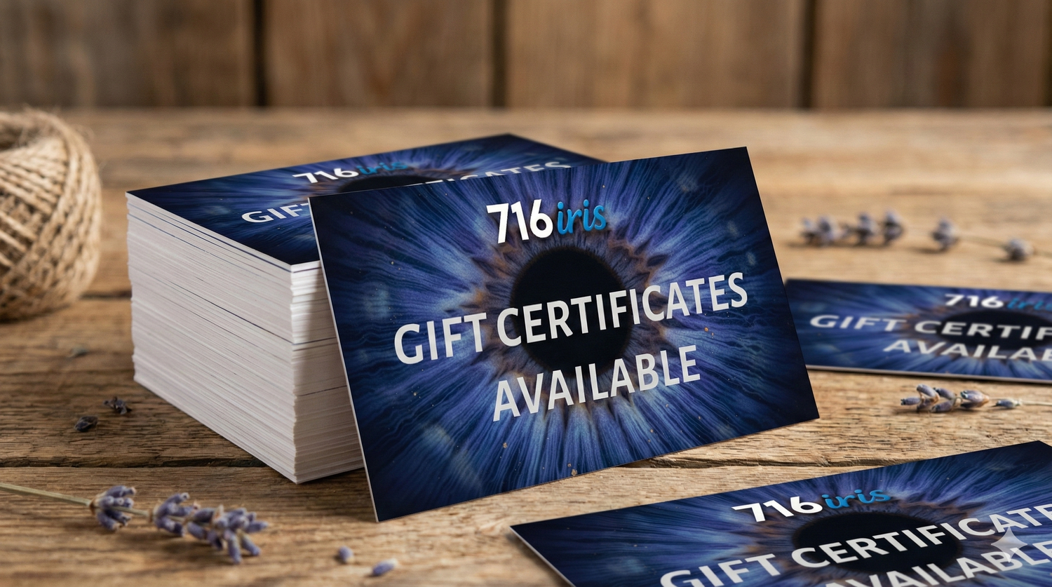 716 iris Professional blue gift certificates with metallic text displayed on dark wooden surface with scattered coffee beans.