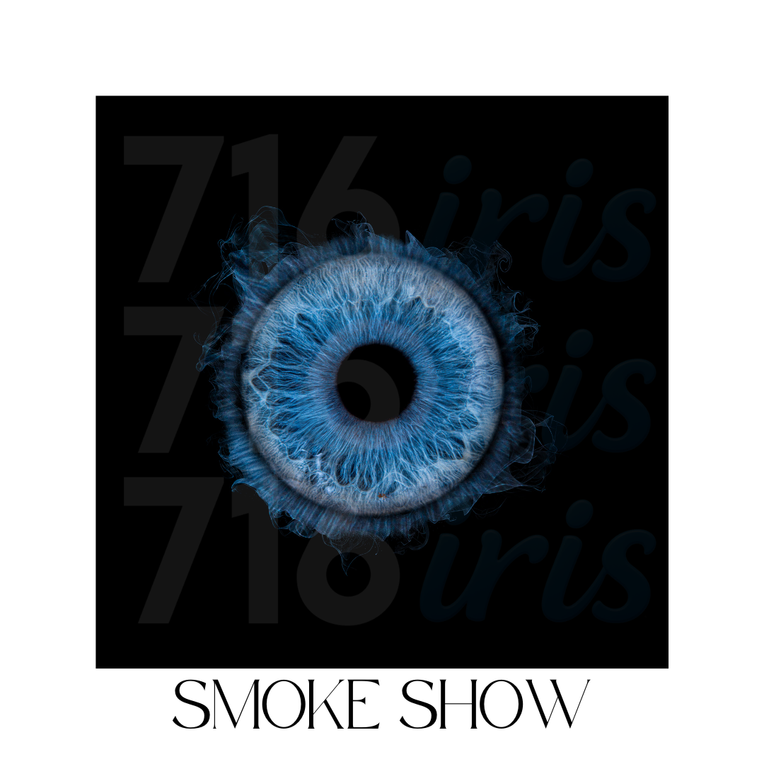 Artistic close-up of a blue glowing eye effect with smoke or mist creating an ethereal atmosphere.
