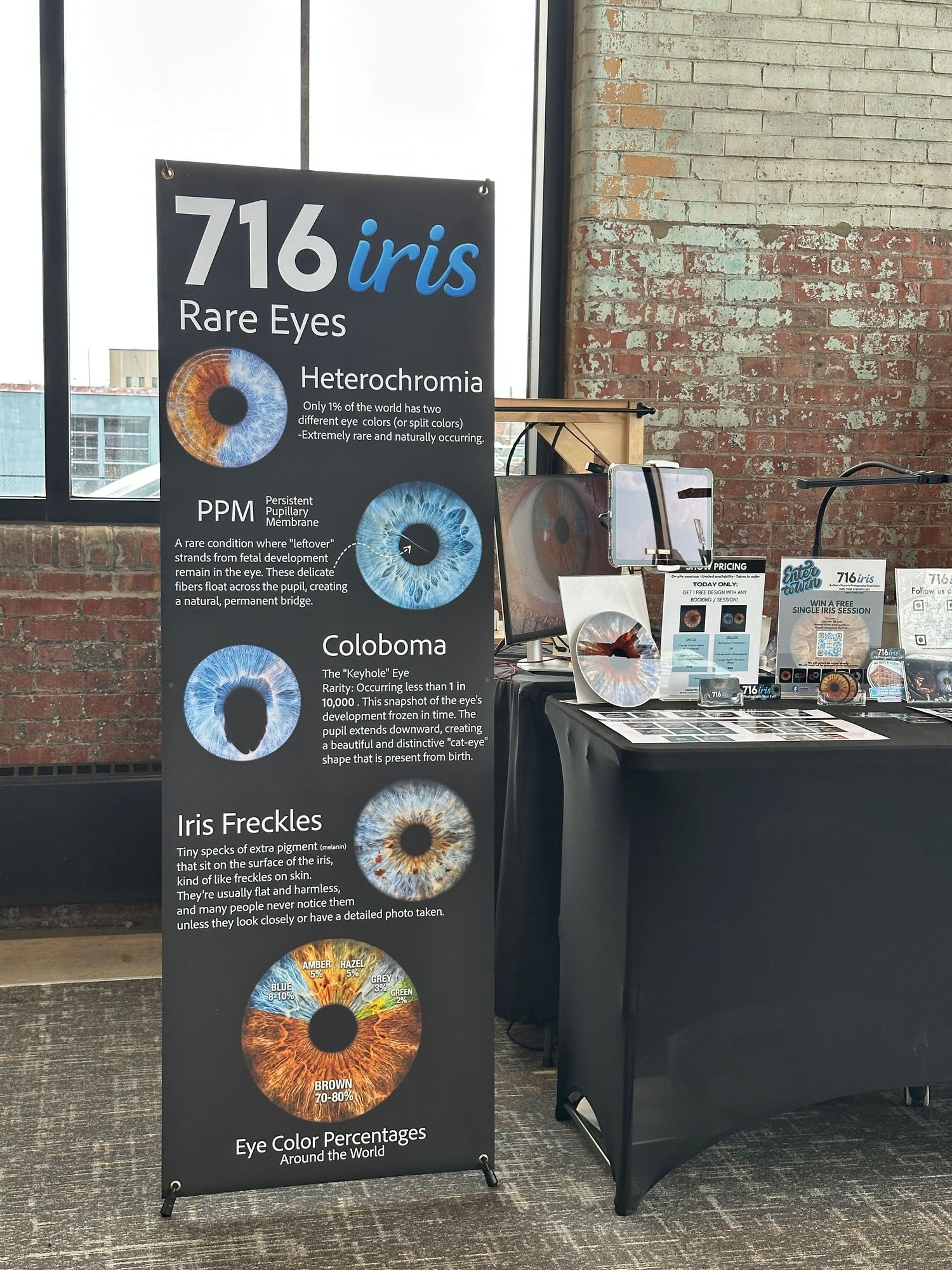 716 Iris rare eyes educational display banner at a trade show booth featuring heterochromia, PPM, coloboma, and iris freckles.