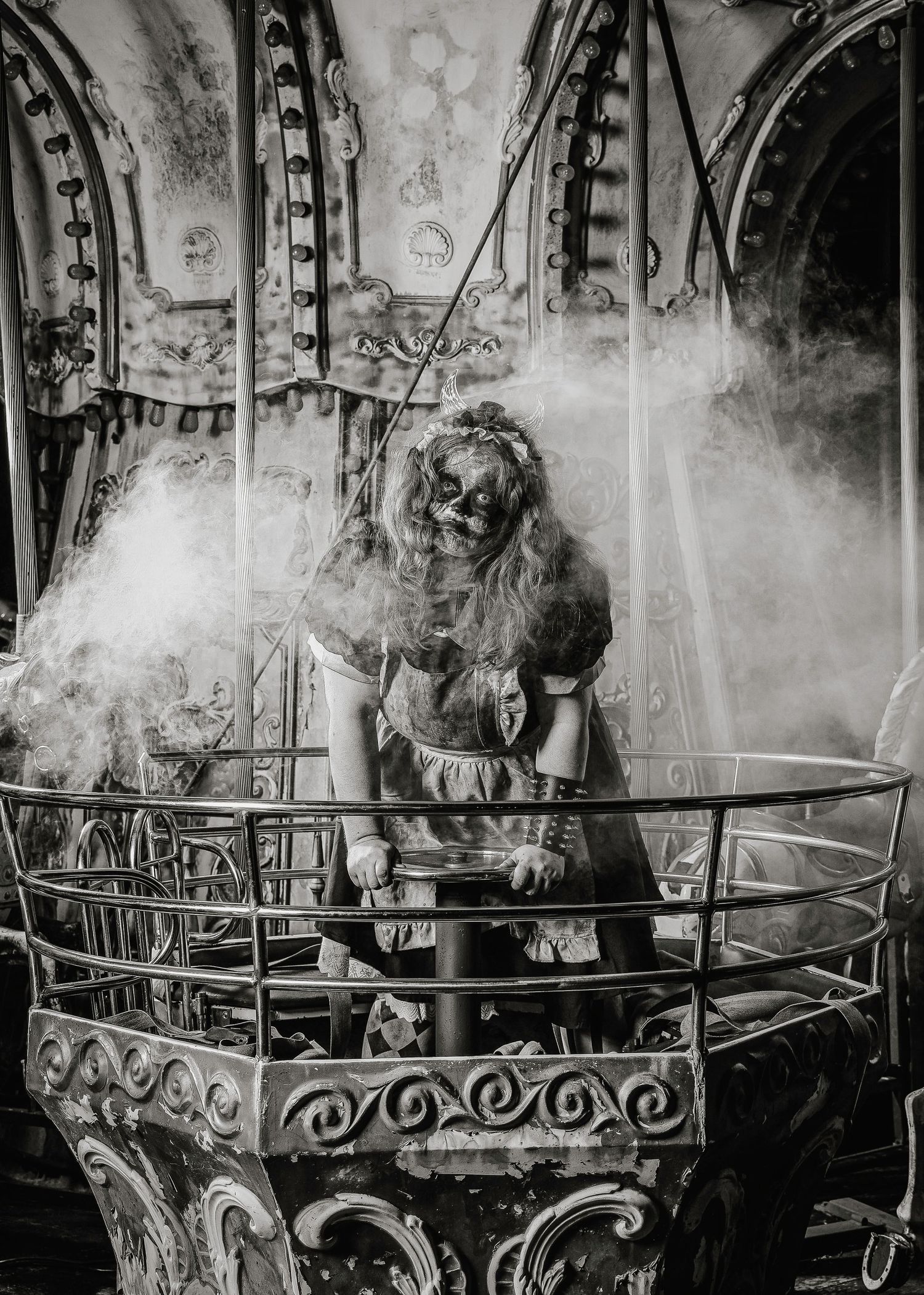 A black and white panoramic sequence showing a carousel with ornate decorative details and rising steam or smoke.