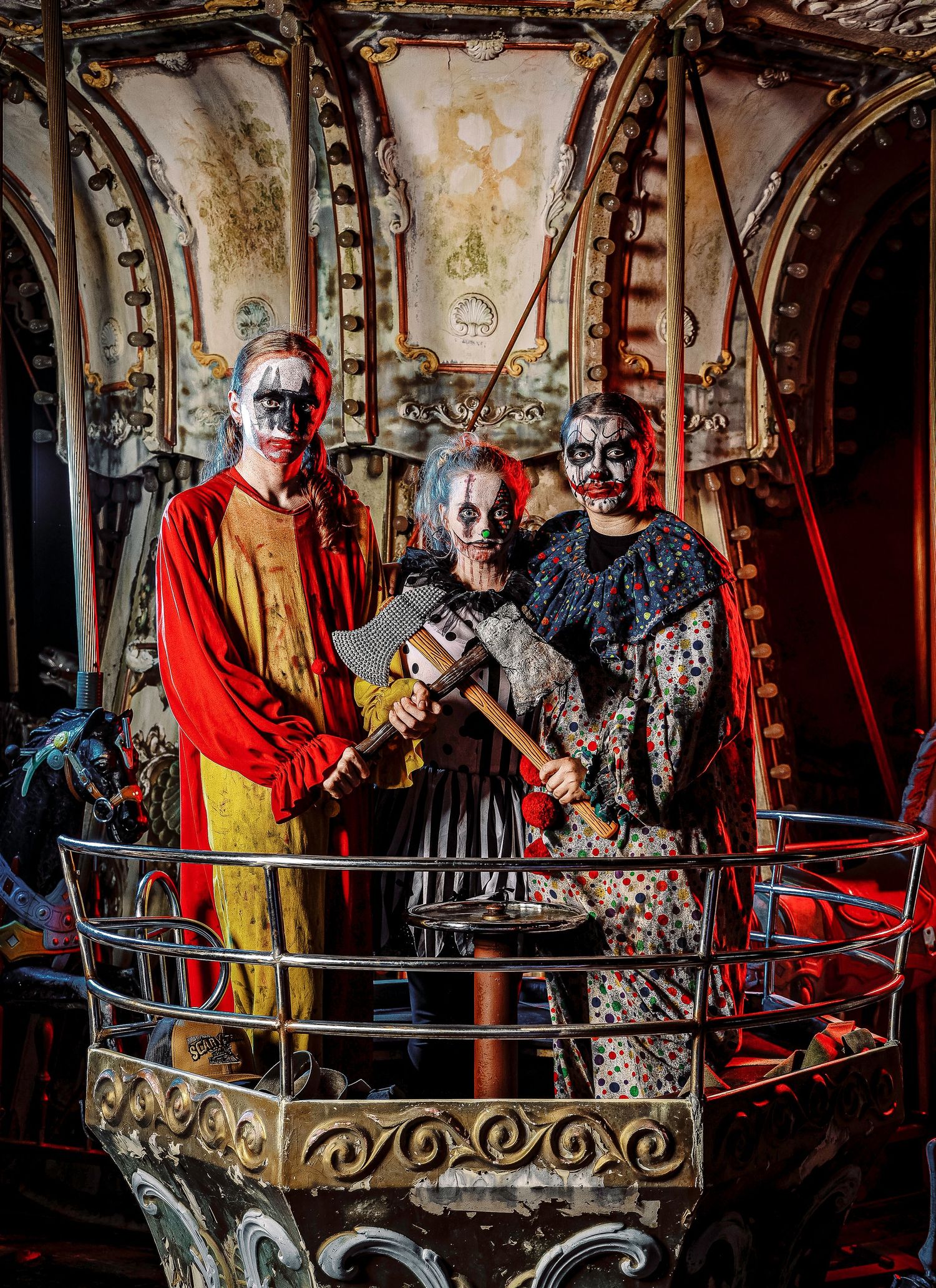 Two performers in medieval costumes interact on a vintage balcony during a theatrical performance.