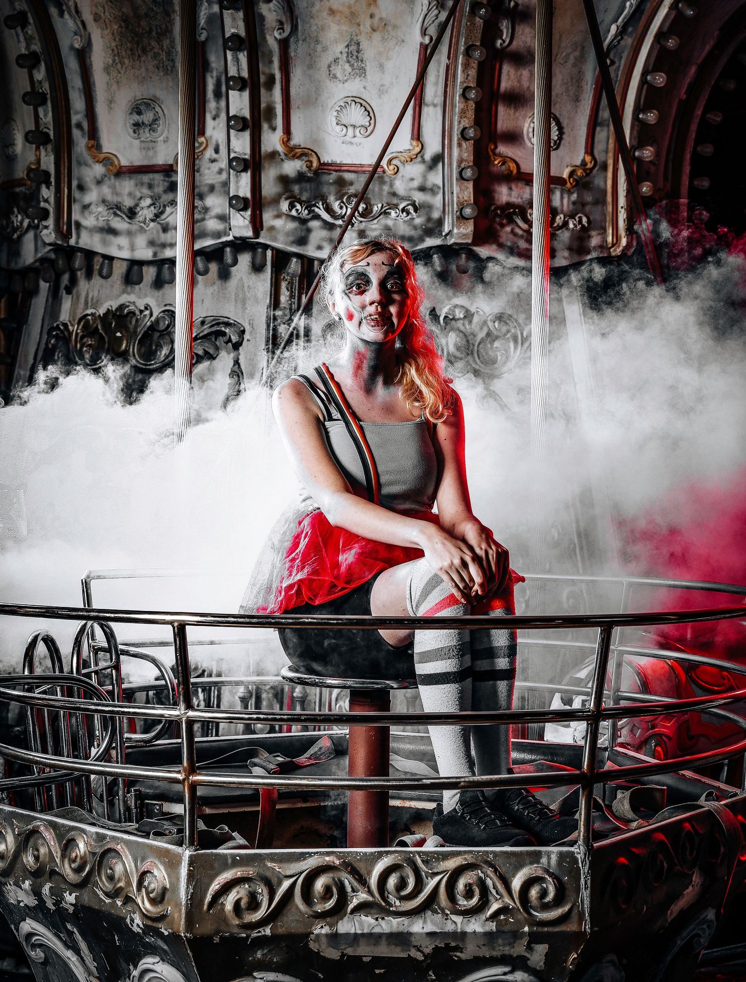 Artistic photo series showing a person in red lighting on a balcony with ornate railings surrounded by atmospheric fog.