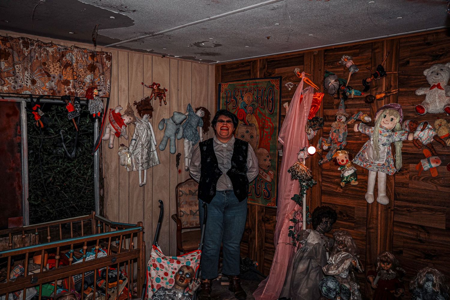 A spooky haunted house attraction features dimly lit corridors with creepy decorations and props.