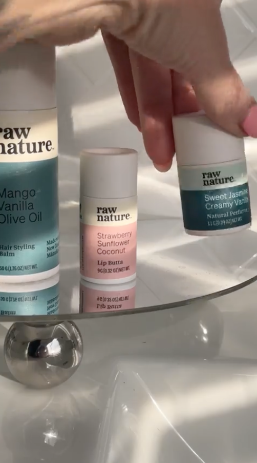 rachael ferguson content creator Collection of natural beauty products with various scents displayed on white surface.