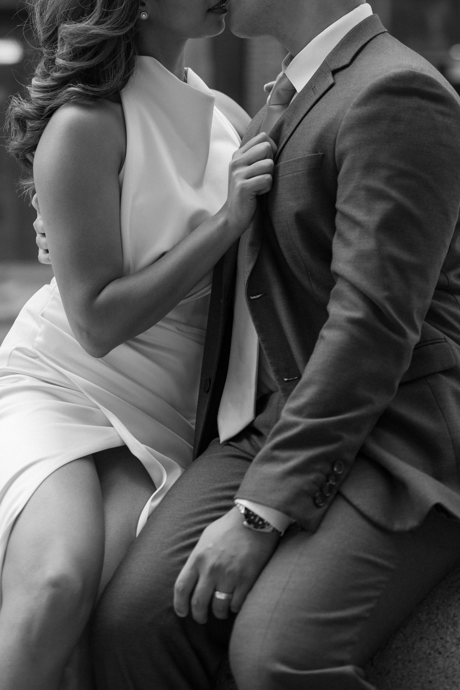 A series of black and white artistic wedding photos showing intimate moments between a couple in formal attire.
