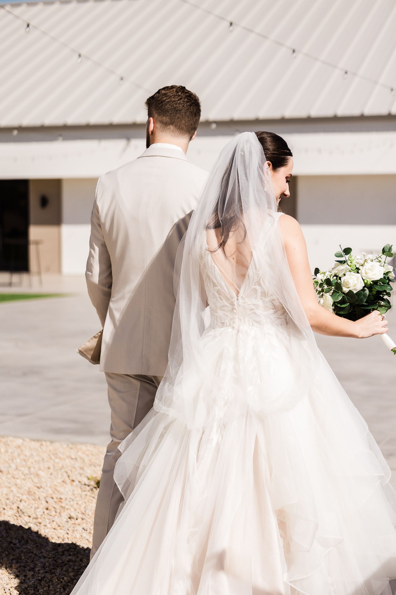 Bride and groom sharing a romantic moment at Desert View, Arizona, captured by Sierra Beltran Photography
