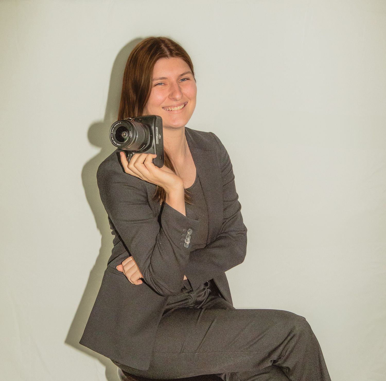 a portrait of Sarah Beth holding her camera