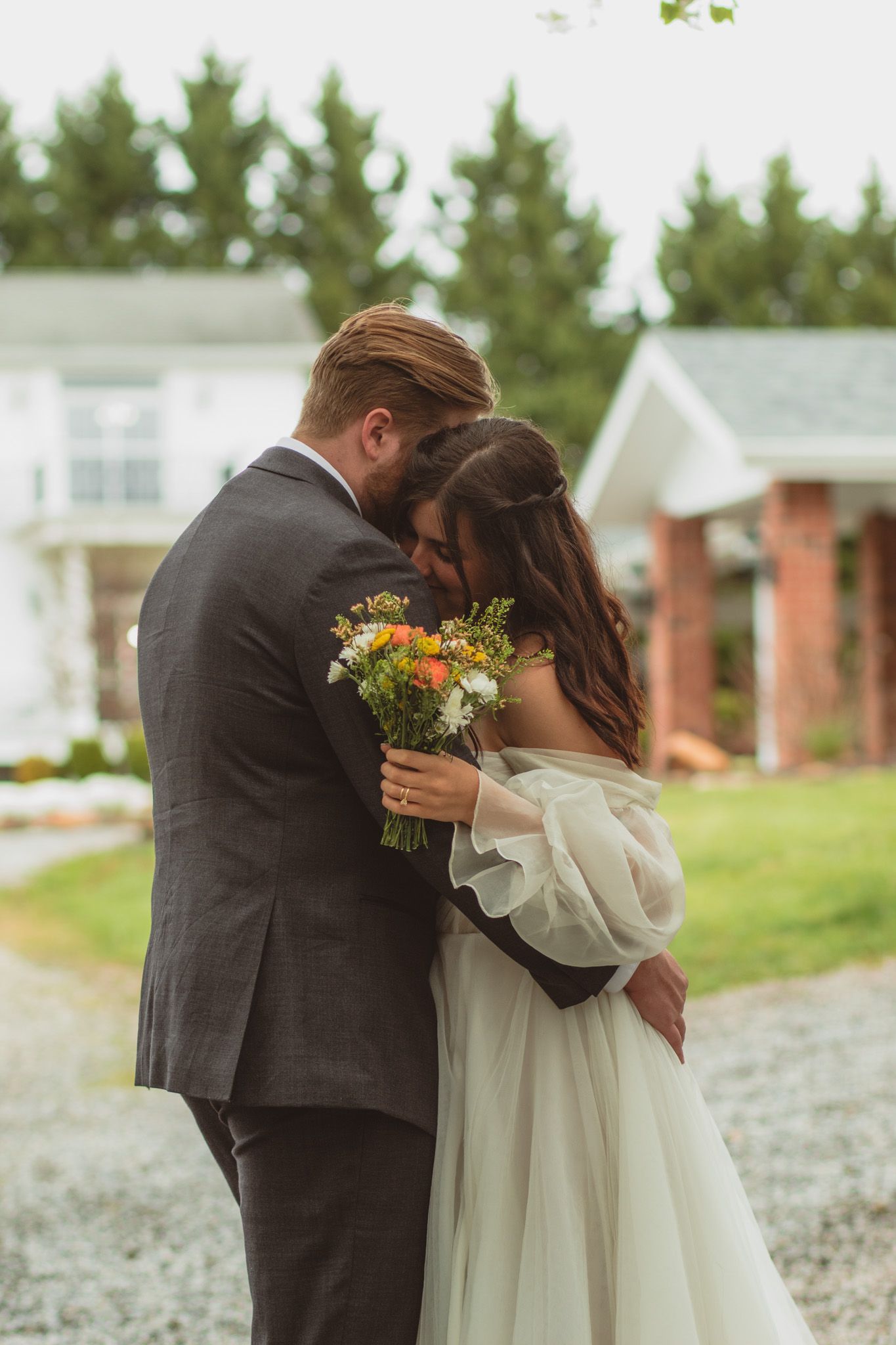 a portrait of a bride and groom embracing