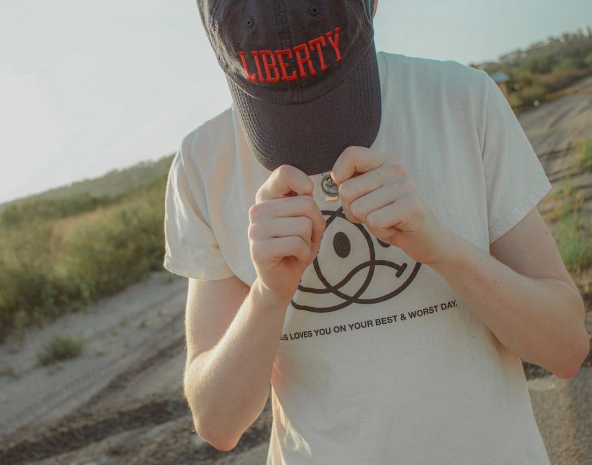 a portrait of a young man showcasing his hat