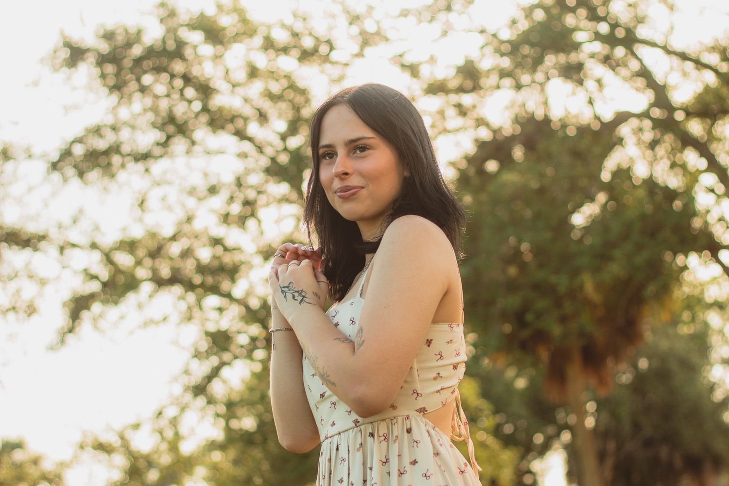 portrait of a young woman backlit by the rising sun