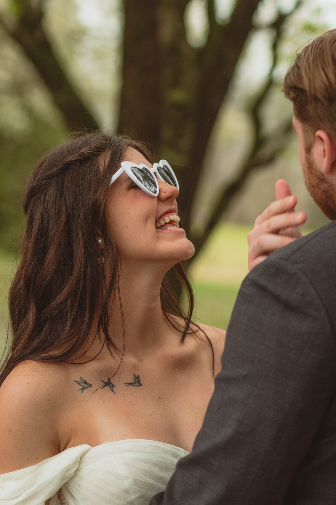 portrait of a bride laughing up at her groom