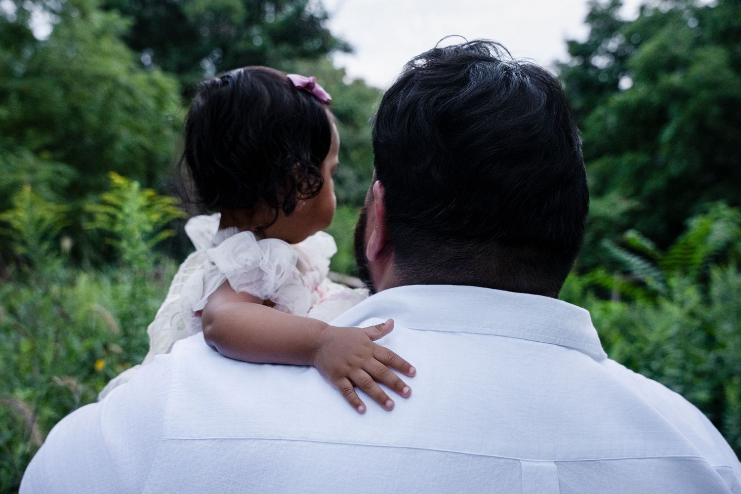 A series of dreamy wedding photos showing romantic outdoor moments in white attire against lush greenery.