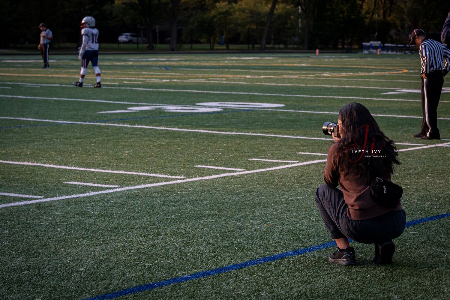 Football players perform a series of photos on the field during a game or practice session.