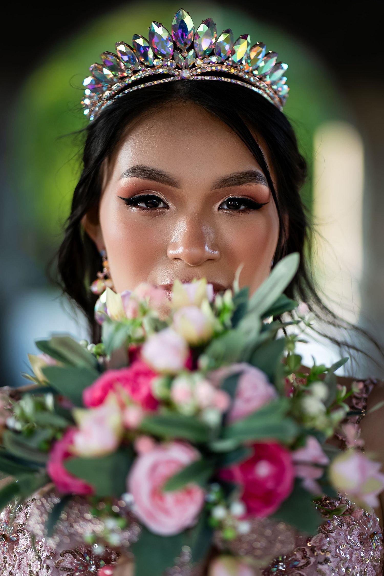 Close-up portrait series showing a crystal tiara and floral bouquet with pink roses and greenery against a dark background.