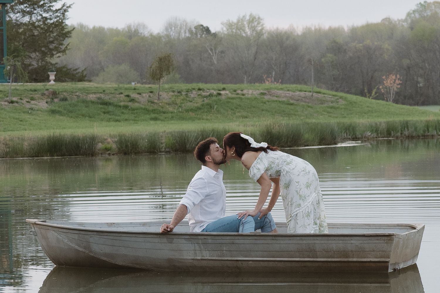 engagement session with row boat on lake