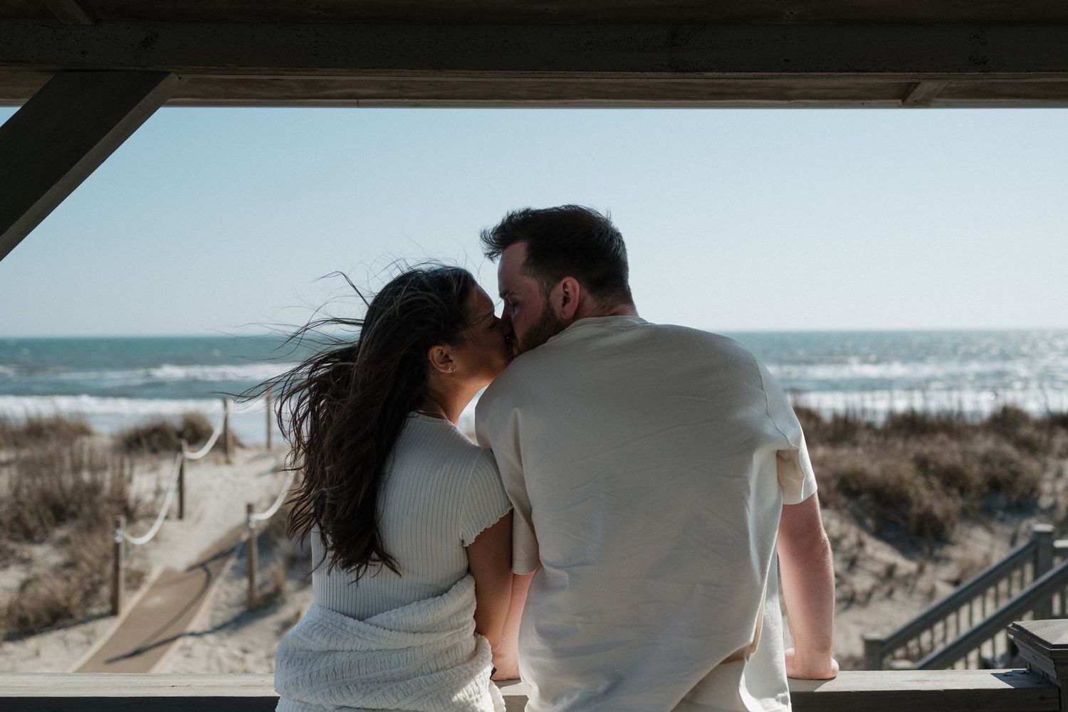 playful documentary couples photos on North Carolina beach