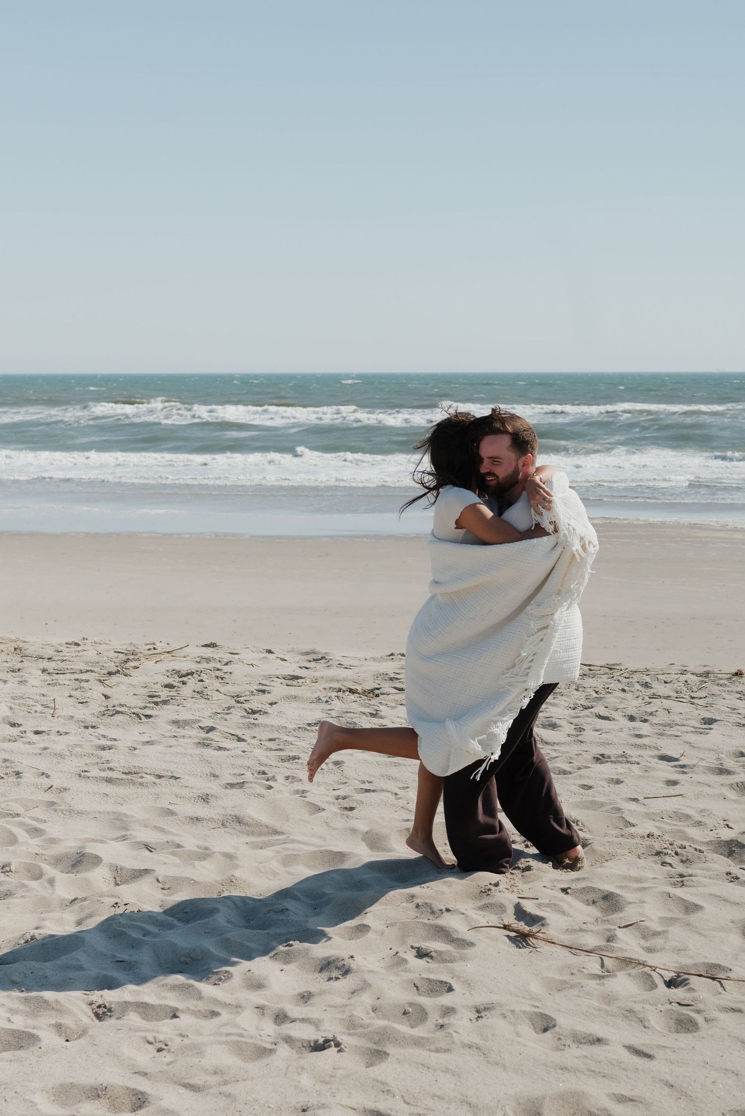 playful documentary couples photos on North Carolina beach