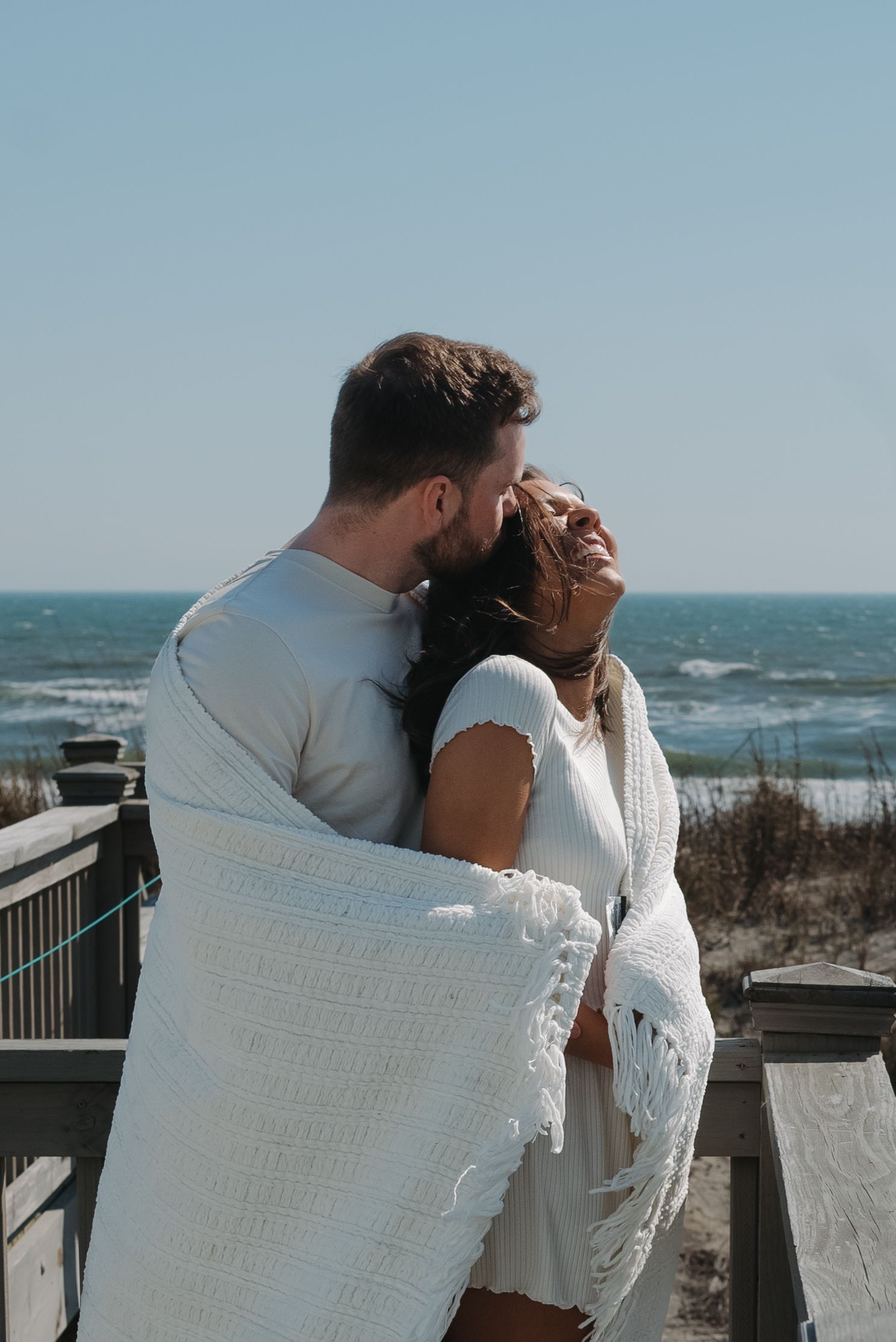 playful documentary couples photos on North Carolina beach