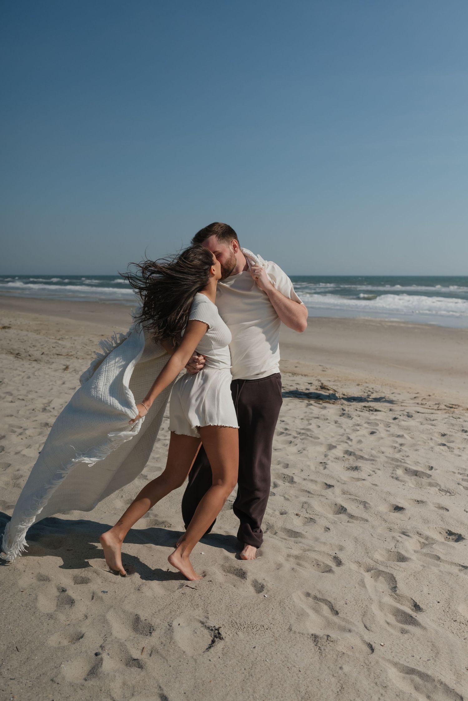 playful documentary couples photos on North Carolina beach