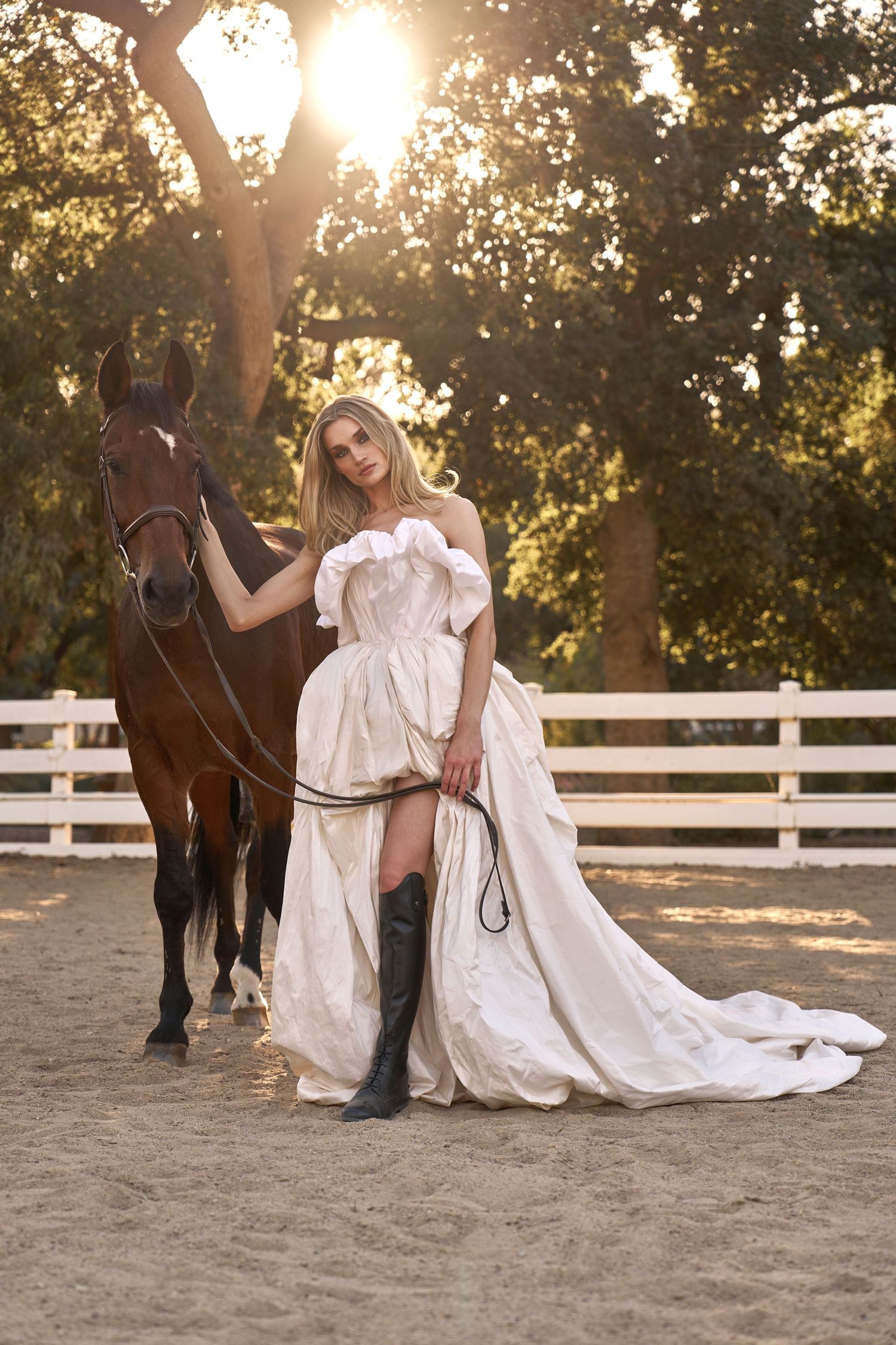 Romantic horse and rider photoshoot in white dress during sunset.