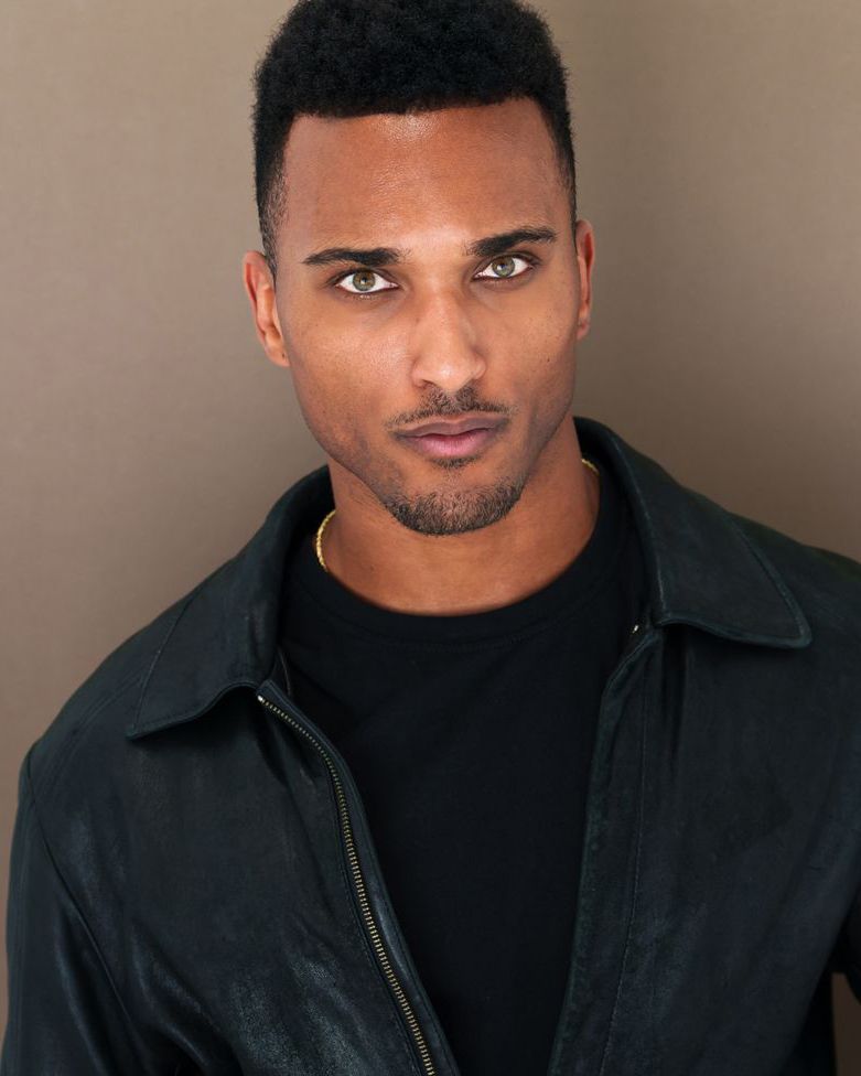 Professional headshots in black turtleneck and jacket against neutral background.