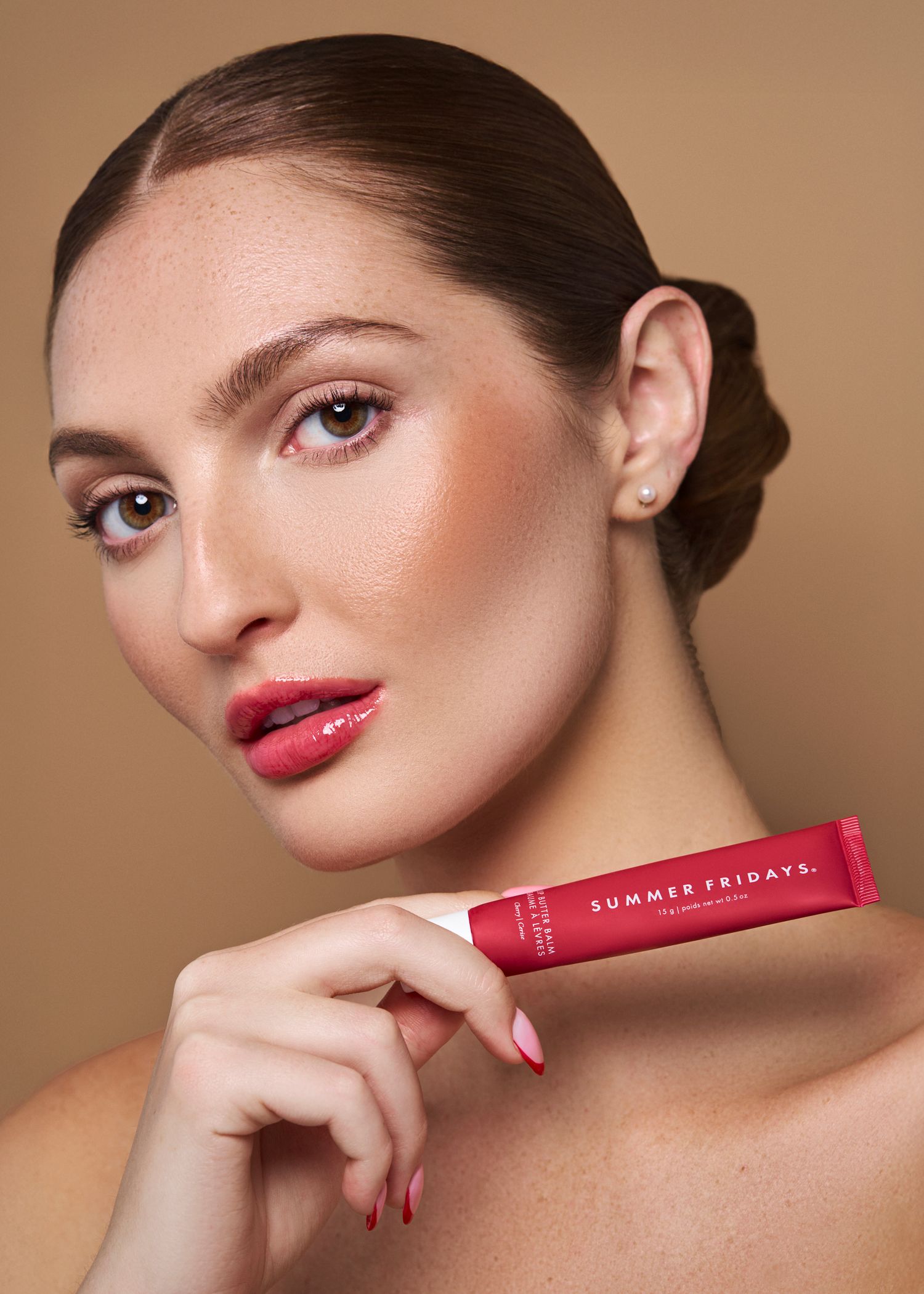 Makeup beauty campaign featuring close-up shots of glossy red lips and natural glam makeup against a neutral background.