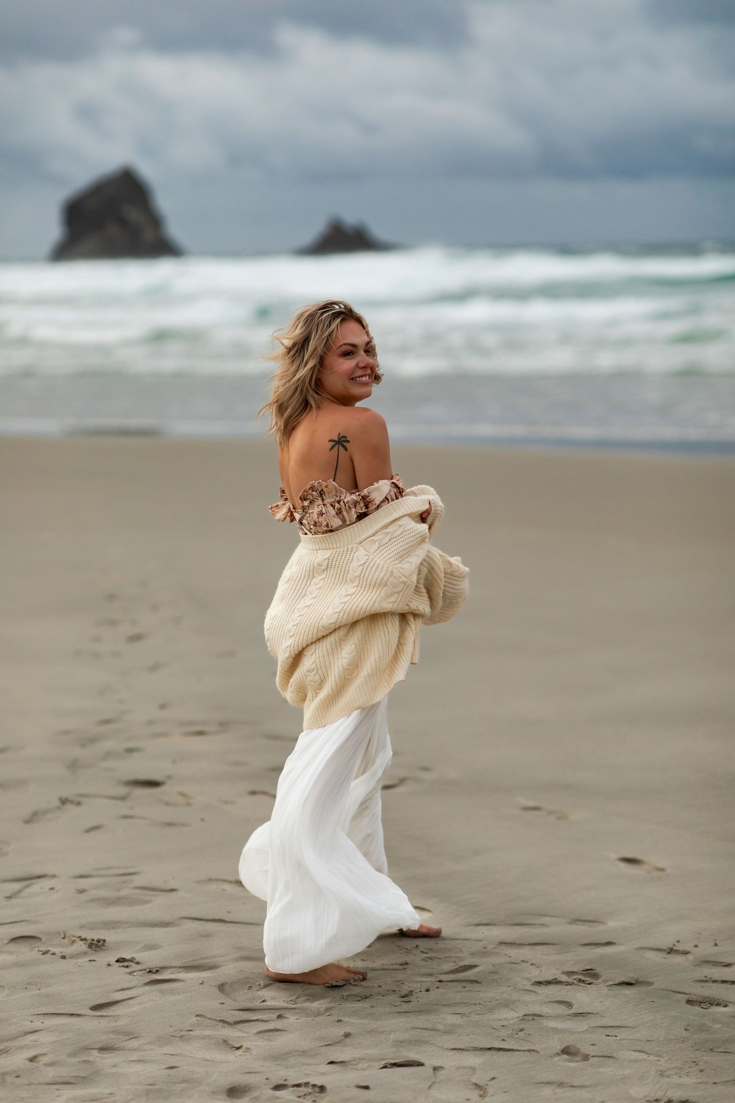 woman on beach in New Zealand flirty and sexy