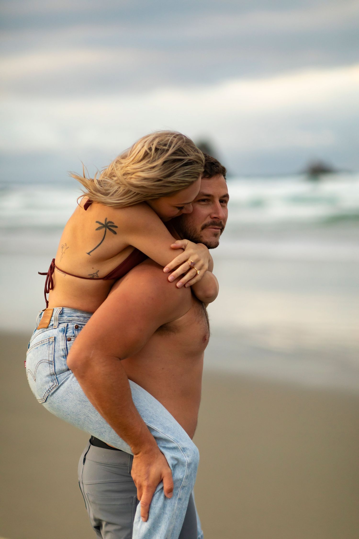 destination photoshoot of beach engagement new zealand couple steamy make out sesh
