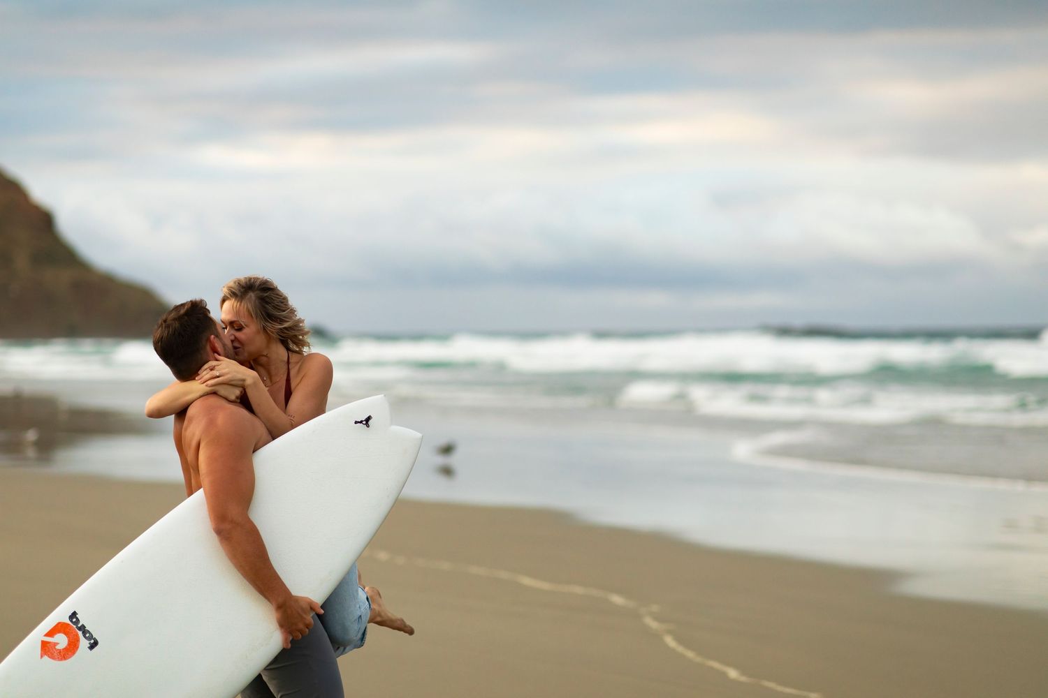 destination photoshoot of beach engagement new zealand couple steamy make out sesh