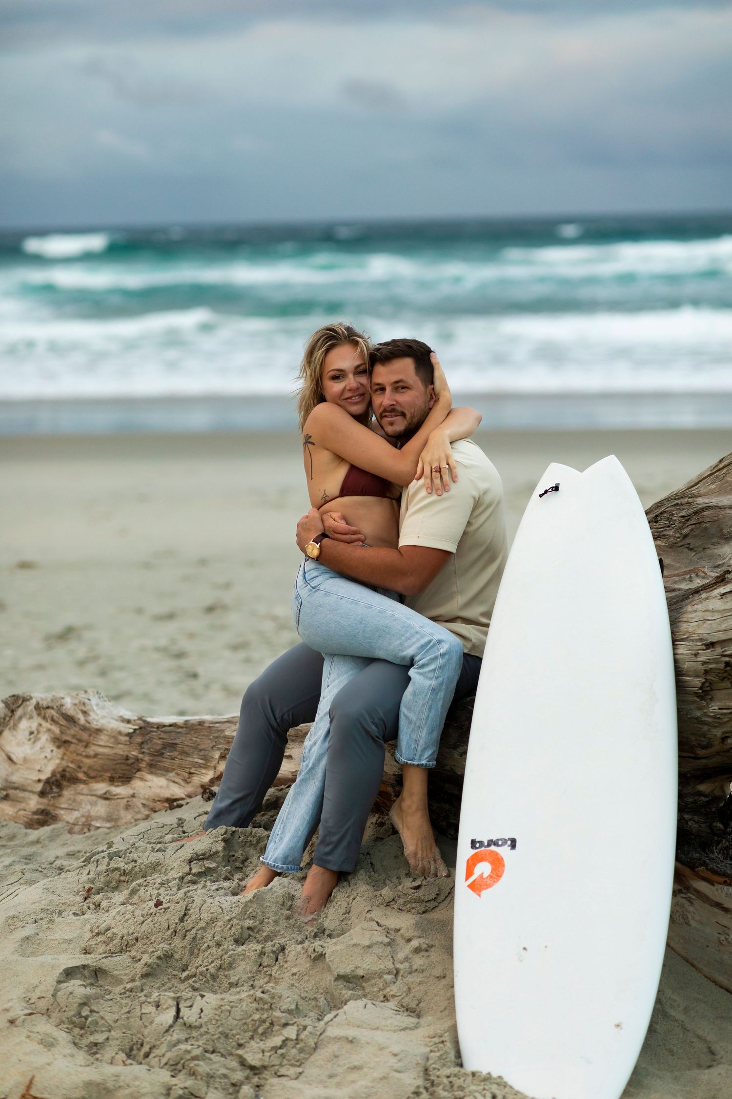 destination photoshoot of beach engagement new Zealand couple steamy make out sesh